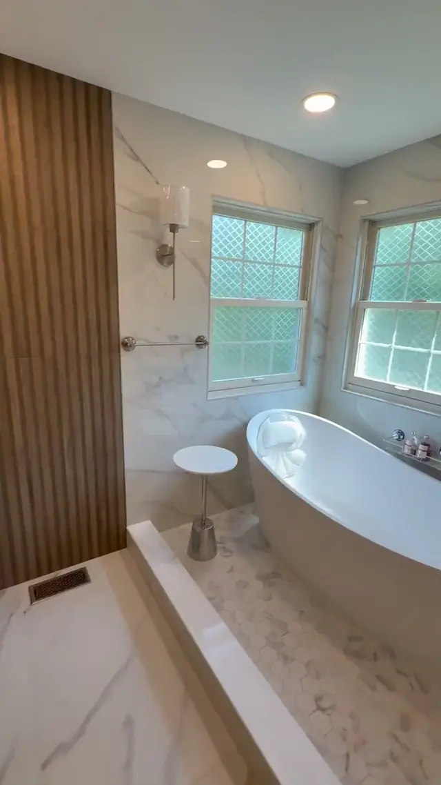 Walkthrough of a finished primary bathroom in Burlington County, NJ, starting at a freestanding tub under two windows