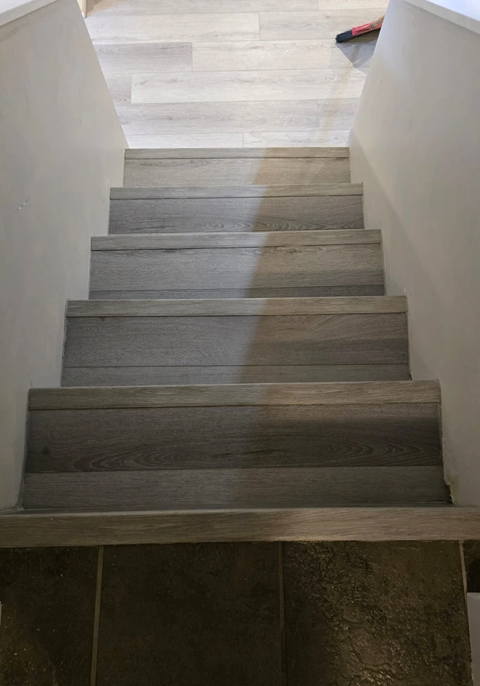 Sleek Staircase with Matching Gray Flooring